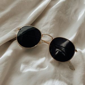 Gold rim round sunglasses